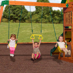 Children on the two belt swings and trapeze bar of the Sunnydale Cedar Swing Set