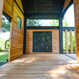 Upper fort of the Canyon Creek swing set with chalkboard and cedar plank deck