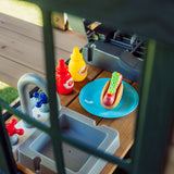 Toy barbecue, sink and play food on the Canyon Creek lower playhouse counter